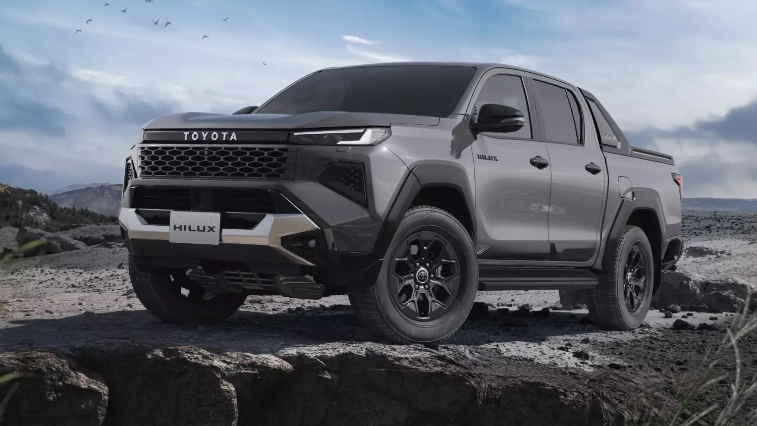Przód nowej Hilux zyskał mocniejszą stylistykę duża osłona chłodnicy i zderzak podkreślają stabilną, „zapaśniczy” wygląd auta.